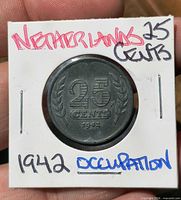Obverse of coin in holder displaying denomination and date