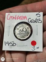 Reverse of 1950 Canada 5 cent coin in flip