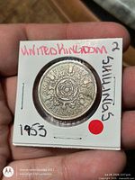 Reverse side showing Tudor rose and denomination in 2x2 flip