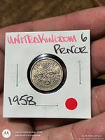 Obverse side of 1958 sixpence in 2×2 holder