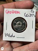 Reverse of 1966 Canadian 5¢ coin showing beaver, denomination, year, inside flip