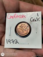 Reverse side showing date 1972 and maple leaf design in holder