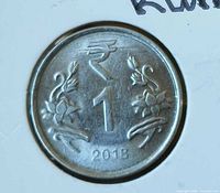 Obverse displaying ₹1 value, floral design, date 2018