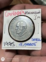 Obverse of medallion in cardboard 2x2 showing Abbott portrait and 1891 date