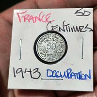 Obverse of coin showing 50 Centimes 1943 legend in flip