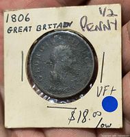 Obverse view of coin in 2×2 flip showing handwritten 1806 Great Britain 1/2 penny