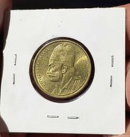 Obverse portrait side of coin in holder