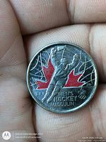 Obverse of 2009 colourized 25-cent coin showing Men’s Hockey design