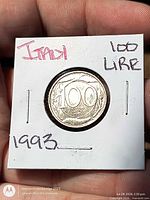 Coin reverse displaying 100 Lire denomination and 1993 date inside flip