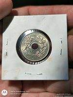 Obverse crowned monogram side of 1967 Danish 25 Øre coin in holder
