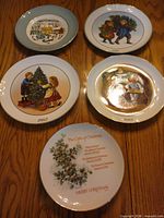 Front view of all five commemorative plates