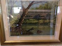 Full view of framed print showing scene, mat and frame