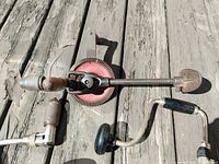 Large eggbeater drill with red gear and two brace drills