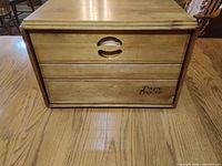 Front view of bread box showing "Daily Bread" lettering and oval pull