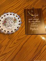 Plate and plaque together on wood surface