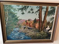 Full view of framed painting showing landscape subject and frame