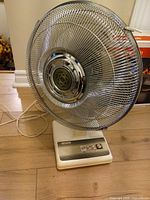 Full view of Sears table fan showing grille, base, cord
