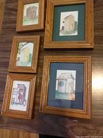 Group shot of five framed outhouse prints
