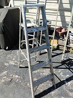 A-frame step ladder with visible paint wear