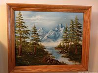 Frontal view of framed oil landscape painting