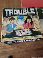 Trouble game box lid showing artwork and title