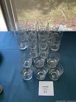 All 16 glasses arranged showing height difference
