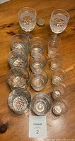 Top view showing entire 15-piece glass set arranged on table
