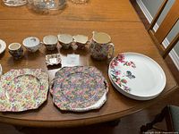 Entire lot laid out on table showing all 16 pieces