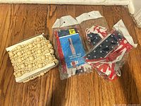 Wood bead garland with three packaged patriotic decor items
