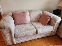 Front view of two-seat sofa with two cushions
