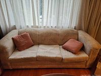 Front view of three-seat sofa with two cushions