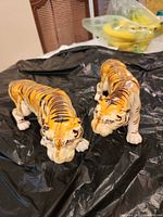 Both porcelain tiger figurines front view