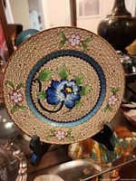 Front of cloisonné plate on stand