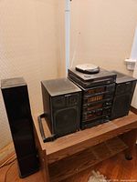 Full view of Sony stereo stack, speakers, cassette tower on stand