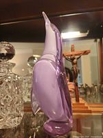 Left profile of purple glass penguin figurine showing overall form and color