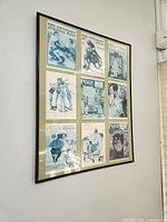 Full view of framed collage on wall