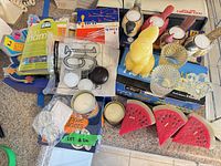 Overview of all assorted candles and holders on counter