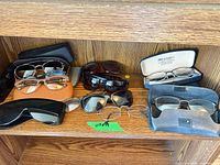 Full shelf view showing all glasses and cases
