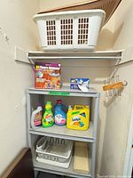 Overall view showing laundry basket, cleaners, dish rack, peg rack