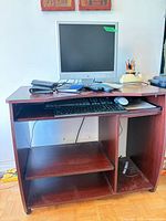 Front view of desk with monitor and accessories (not included) showing overall design and condition