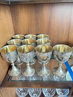 All ten goblets displayed on shelf