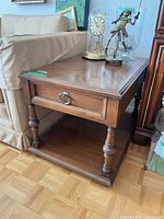 Full view of Pepplers side table beside sofa