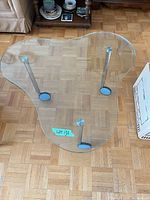 Top view of kidney-shaped glass side table