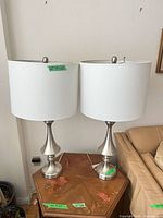 Both matching table lamps on side table showing overall look