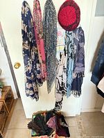 Door with hanging scarves and knit hat