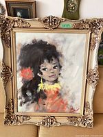 Full view of framed oil portrait painting in ornate frame