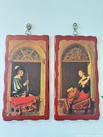 Both musician plaques hanging side by side
