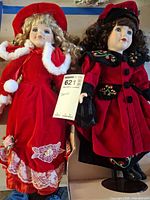 Both dolls side by side showing overall outfits and size