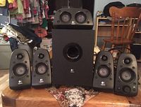 Front view showing subwoofer, center channel and four satellite speakers