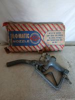 Nozzle in front of original OPW Fil-O-Matic box